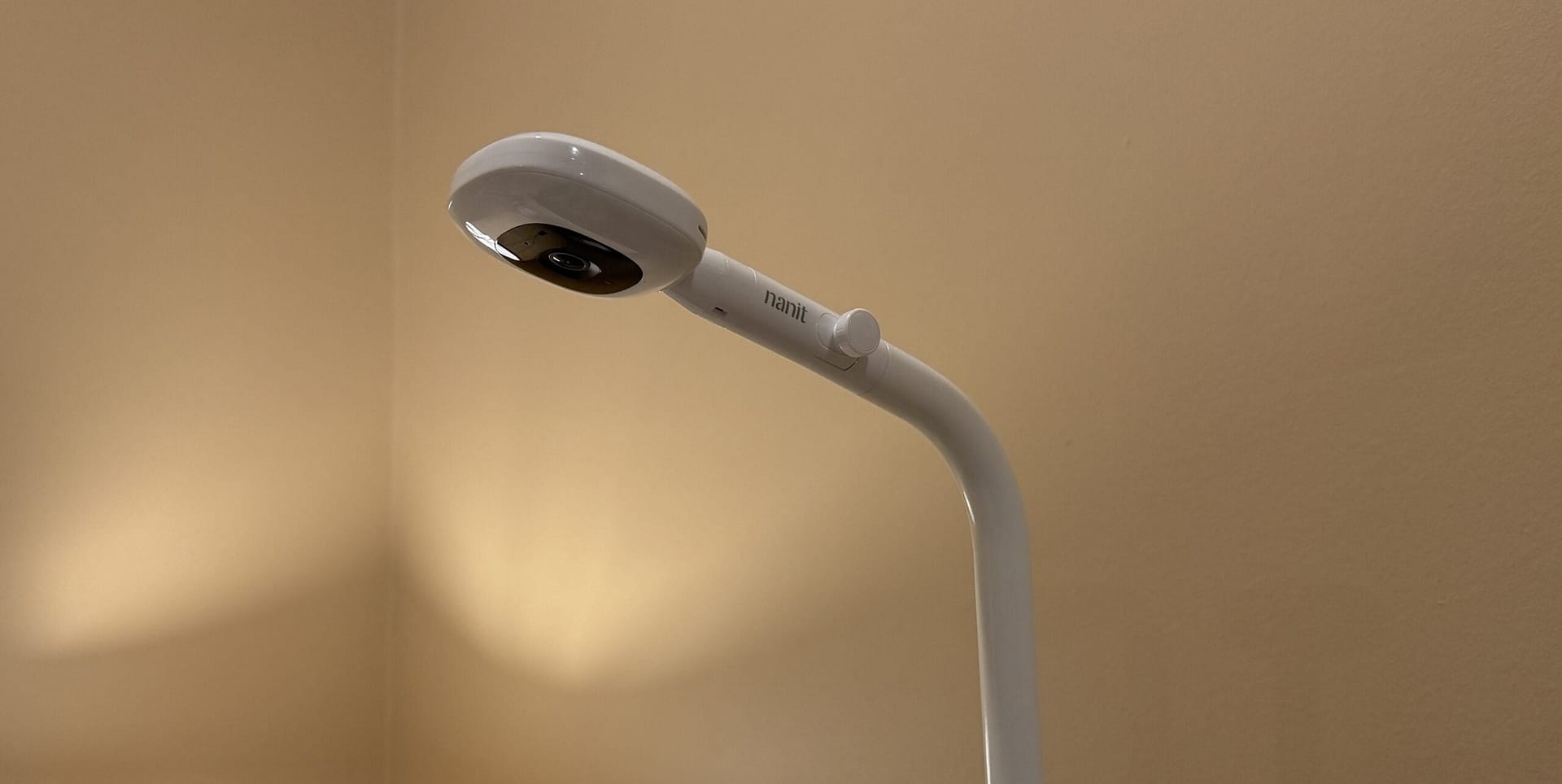 Nanit baby monitor camera above a toddler bed for connected parenting